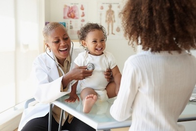 Pediatrician listening to a baby's heart