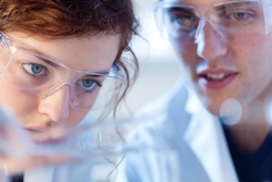 two medical scientists working in a lab