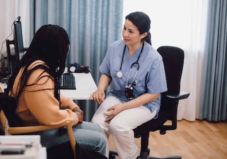 physician speaking with a patient